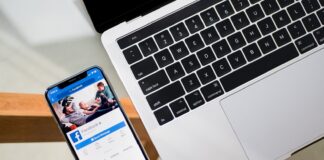 iPhone X beside MacBook