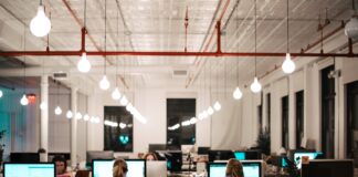 people sitting on chair in front of computer