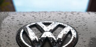 water dew on silver Volkswagen car emblem