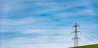 electrical tower on grass field