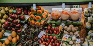 red and brown fruit on brown wooden crate