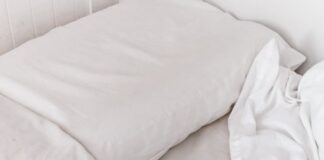 white textile on white bed