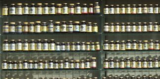 assorted labeled bottle on display shelf