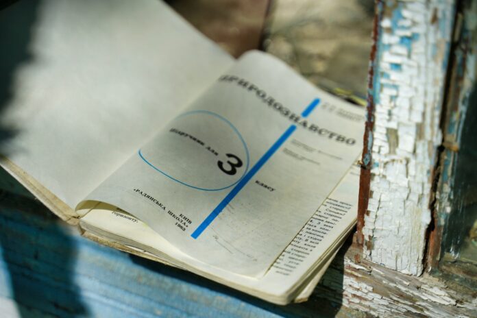 white book page on brown wooden table