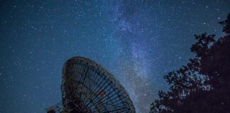 white satellite dish under blue sky during night time