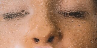 woman in water with water droplets