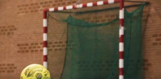yellow and black soccer ball on field