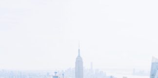 birds-eye view photo of city buildings with fog