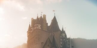 reflection of a castle surrounded with fogs