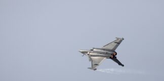 gray fighter jet in the sky