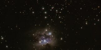 two stars in the middle of a black sky