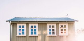 white vehicle near beige house