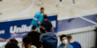 a man wearing a blue jersey