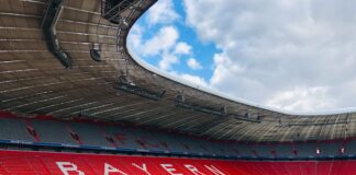 red and white stadium under blue sky during daytime