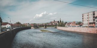 a body of water with buildings along it