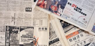 a pile of newspapers sitting on top of each other