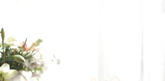 woman sleeping on bed beside book