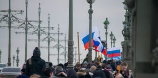 group of people walking straight during daytime