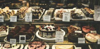 chocolate cupcakes on white wooden shelf