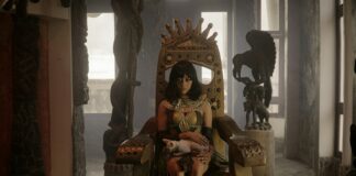 a woman sitting in a chair with a cat in her lap