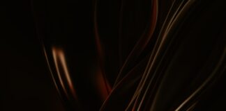 a black and red background with wavy lines
