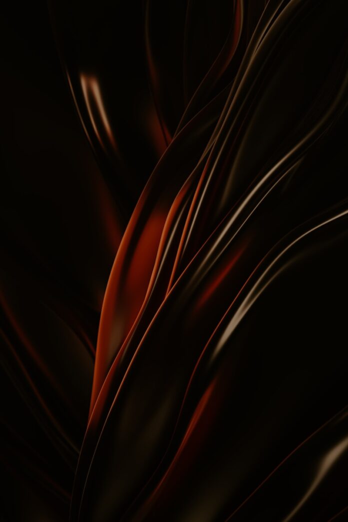 a black and red background with wavy lines
