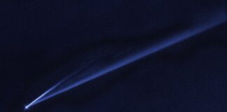 a light emitting from the top of a dark object