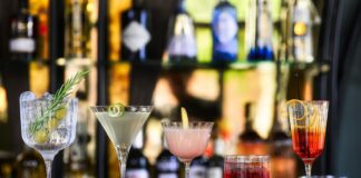 clear cocktail glass with pink liquid inside