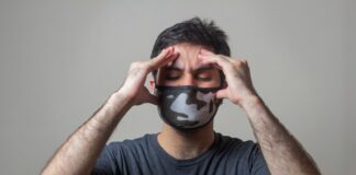 man in black crew neck t-shirt wearing black and white mask