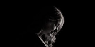 pregnant woman holding tummy