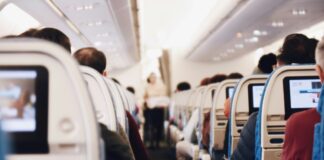 shallow focus photography of people inside of passenger plane