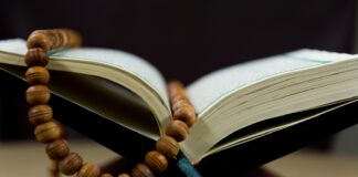 brown beaded necklace on book page