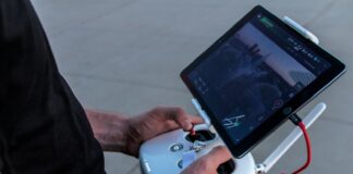 person holding quadcopter controller