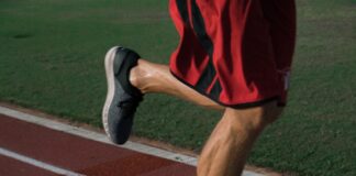 person running on tracking field