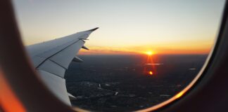 airplanes window view of sky during golden hour
