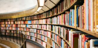 books on brown wooden shelf