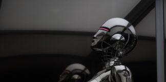 stainless steel robot toy in close up photography