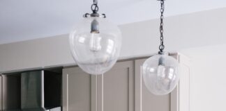 two brown wooden bar stools