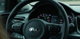 black and gray mercedes benz steering wheel