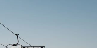 a ski lift going up the side of a hill