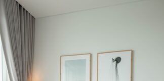 a living room filled with furniture and a large window