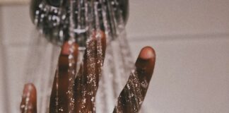 persons hand with silver ring