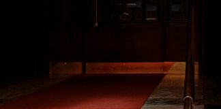 red concrete staircase with stainless steel railings