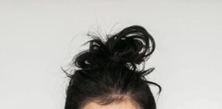 woman in white crew neck shirt smiling