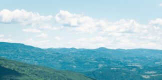 aerial view of green mountains and river