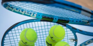 green tennis ball on white net