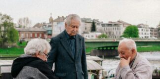 a group of people playing chess