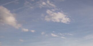 a view of a body of water with a bridge in the background