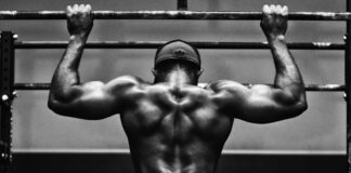 grayscale photo of man working out