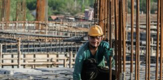 a man in a hard hat working on a construction site